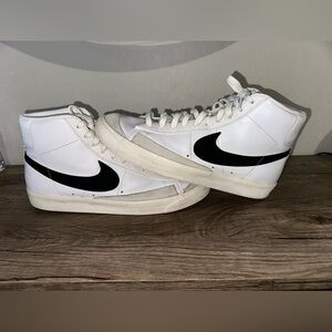 Nike White High-Top Sneakers with Black Swoosh